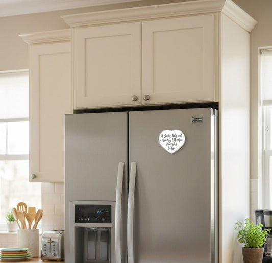 The small heart-shaped magnet is attached to the right fridge door.