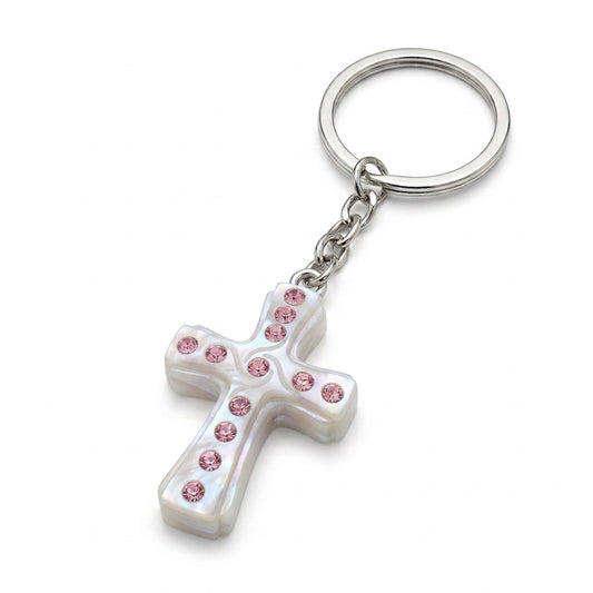 A close-up of a white cross keychain decorated with pink rhinestones, shown next to a pink gift box with a ribbon and a heart-shaped 'Thank you' tag.