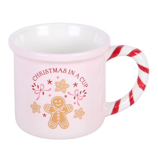 Pink mug with candy-cane striped handle and Christmas in a Cup text graphic