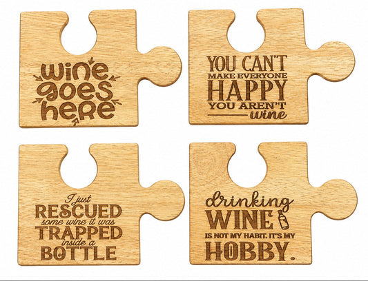 Four wooden puzzle-piece-shaped coasters with humorous wine-themed quotes, arranged in a 2x2 grid on a white background.