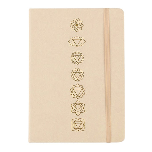 A5 notebook cover with a vertical row of gold lotus and chakra icons