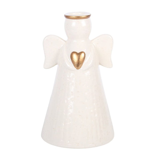 White angel taper candle holder with gold heart centerpiece and twin wing design