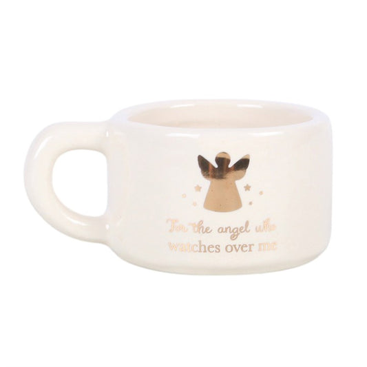 White ceramic tealight holder with handle and angel graphic, “watches over me” on front