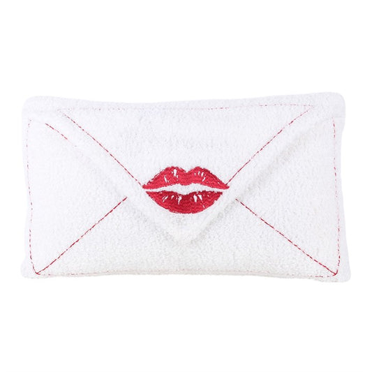 White boucle envelope cushion with red lips applique and red diagonal stitched panels