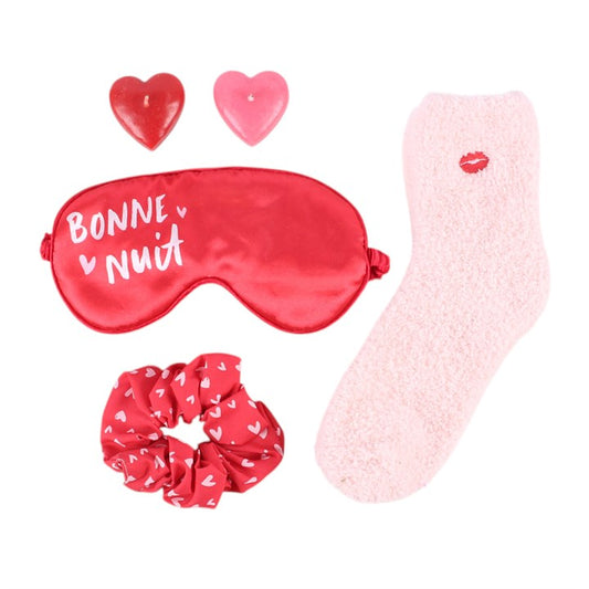 Sleep mask, heart scrunchie, and pink socks with lip print plus small heart decorations