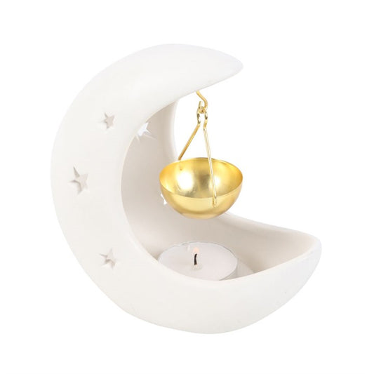 White crescent moon oil burner with star cutouts and gold hanging dish