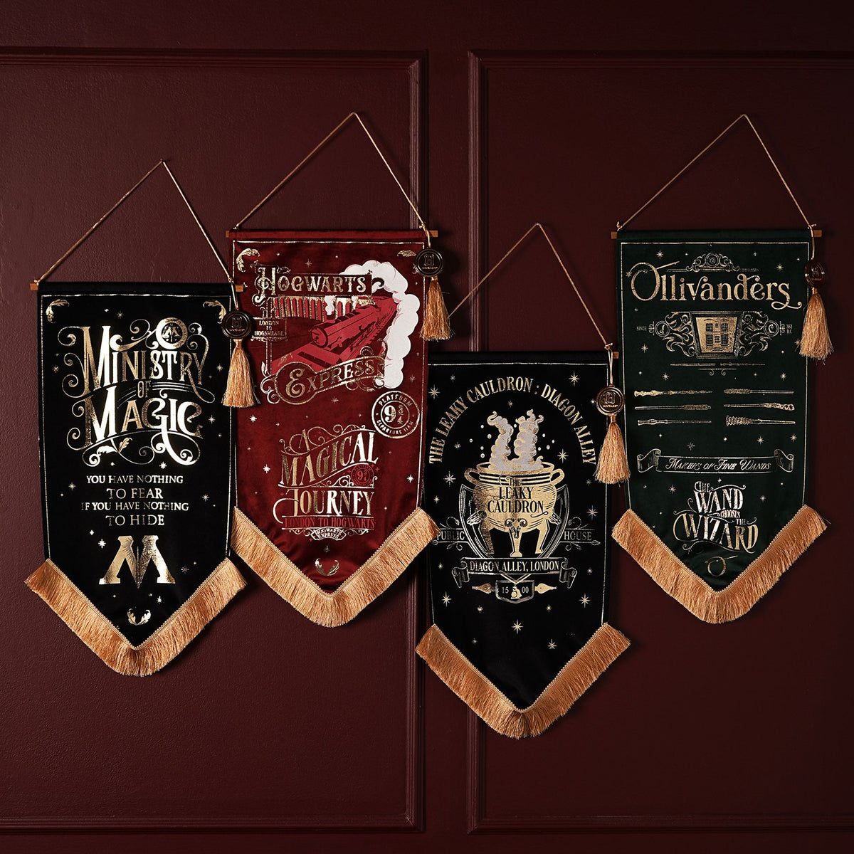 Set of Wizard world fabric banners with tassels and gold trim on hooks
