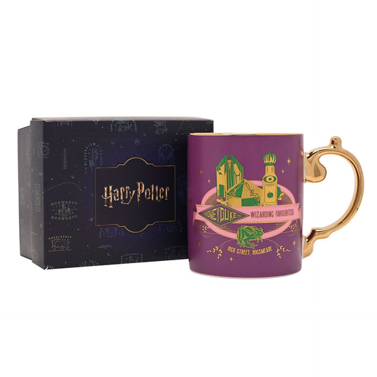 Purple Honeydukes graphic mug with gold handle, shown with gift box