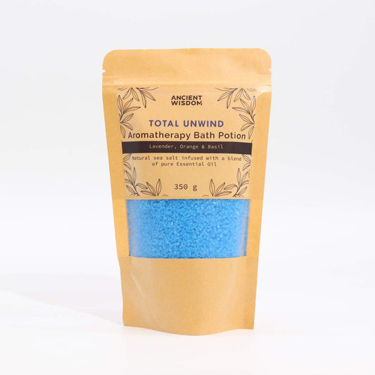 Kraft bag bath potion labeled Total Unwind with blue bath crystals, 350 g