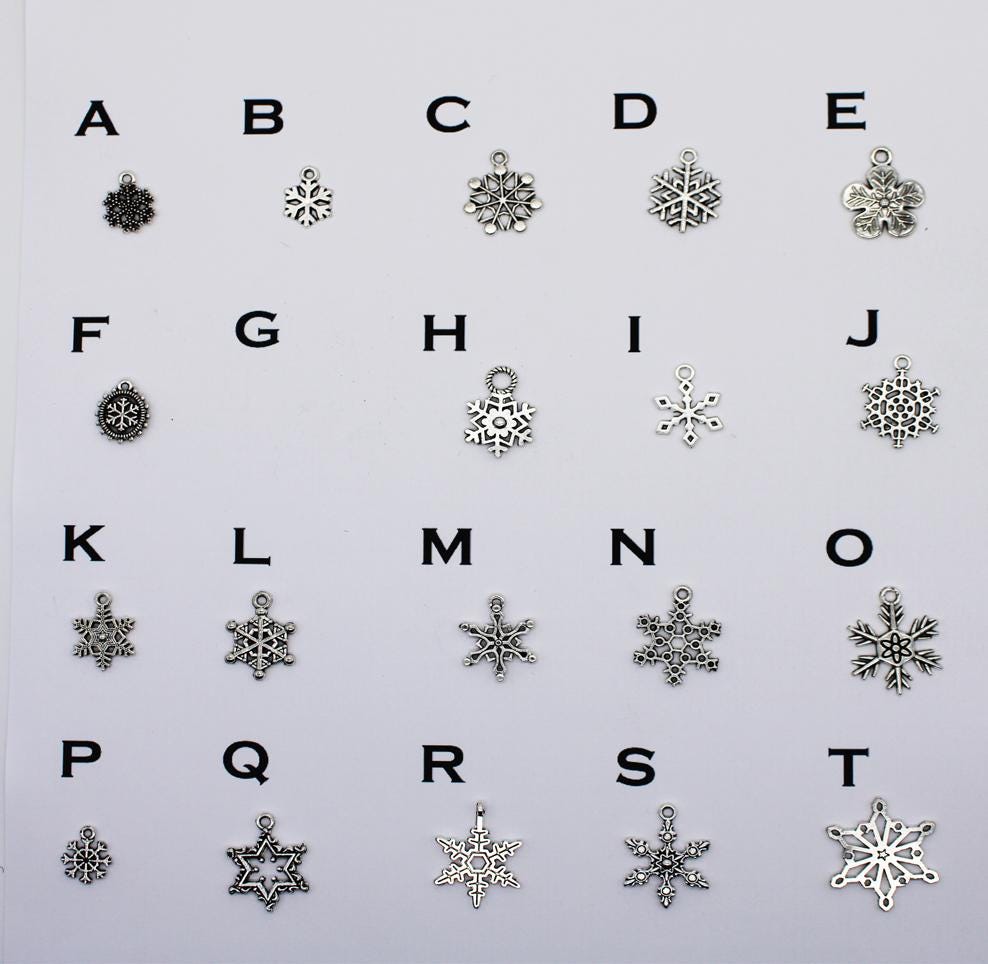 Assorted silver plated snowflake earring designs labeled A–T