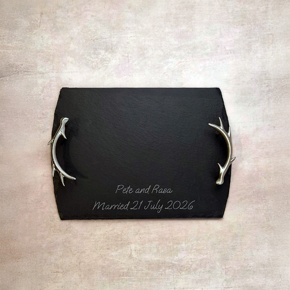 Dark slate serving tray with silver antler handles and engraved names/date.