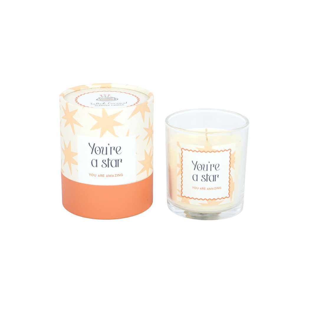 Star-themed scented candle with glass jar and “You’re a star” label, small wick visible
