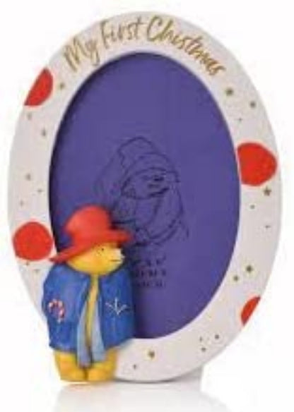 Decorative photo frame with a cartoon character and 'My First Christmas' text on a white background.