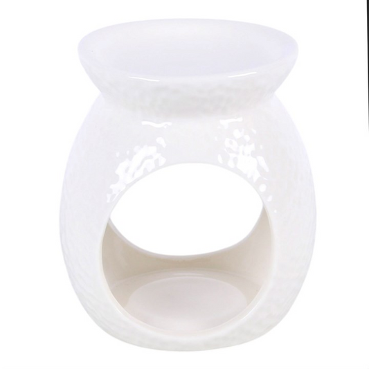 White ceramic wax warmer with dimple texture and large round cutout opening