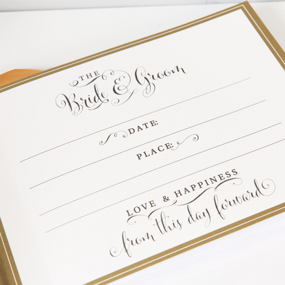 Gold-foil wedding album cover text “The Bride & Groom” with date and place lines