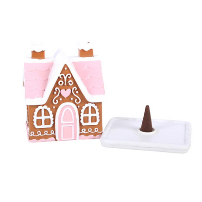 Pink gingerbread house incense cone burner with raised tray and standing incense cone
