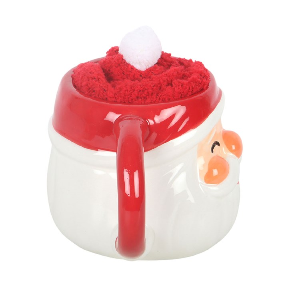 Santa face ceramic mug with red handle and fuzzy red hat, angled view