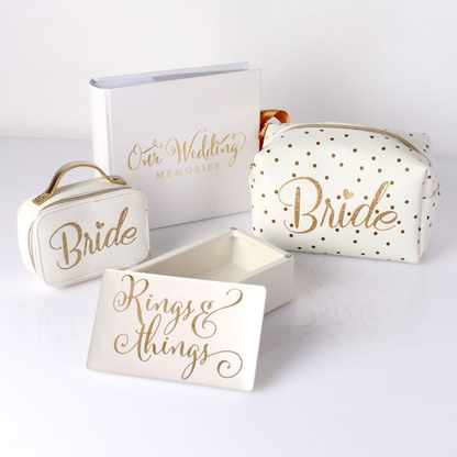 White wedding photo memories album with gold foil “Our Wedding Memories” and ribbon