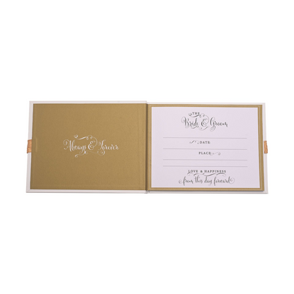 Opened wedding guest book with gold foil design and entry lines for "Date" and "Place"