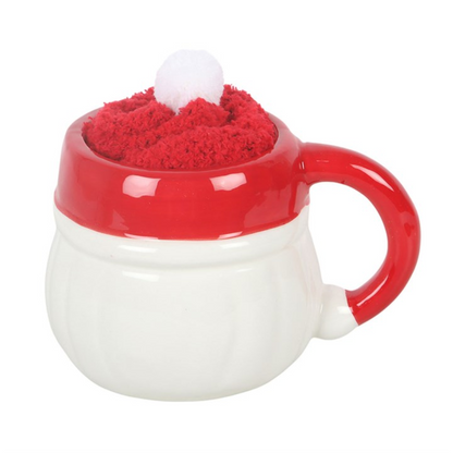 Santa face ceramic mug with red top band and loop handle, fuzzy hat