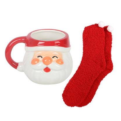 Santa face ceramic mug with red handle and matching fuzzy red socks