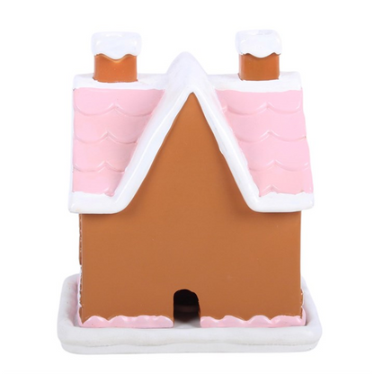 Pink gingerbread house incense cone burner with brown front wall and two chimneys