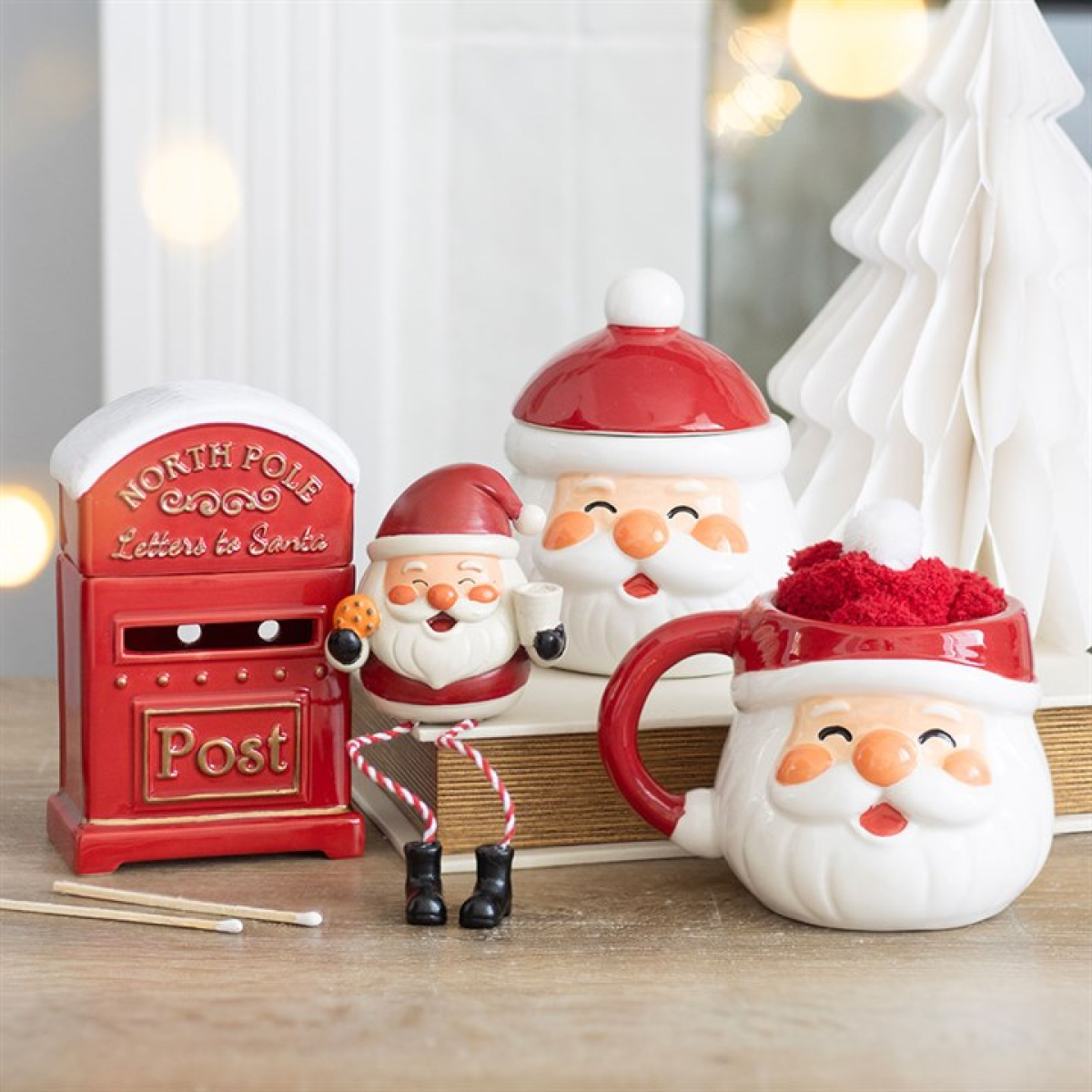 Santa mug and socks set with additional small Santa figures on display