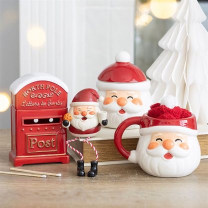 Santa mug and socks set with additional small Santa figures on display