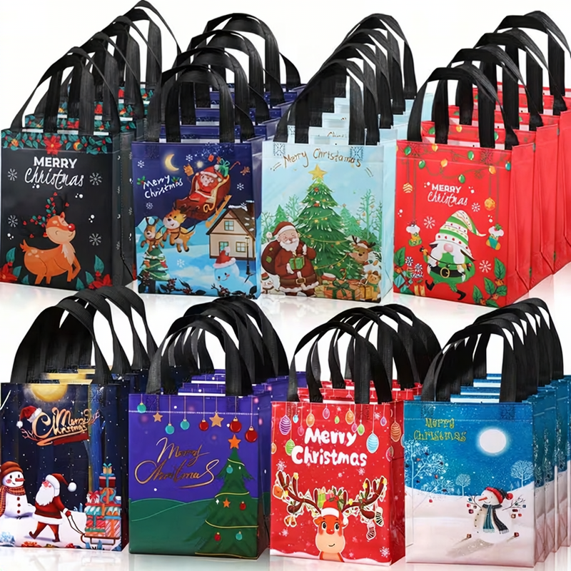 Reusable Christmas themed gift bags with black handles, arranged in two rows. The bags feature various festive holiday illustrations including Santa Claus, reindeer, snowmen, and Christmas trees in multiple colours like red, blue, green, and purple.