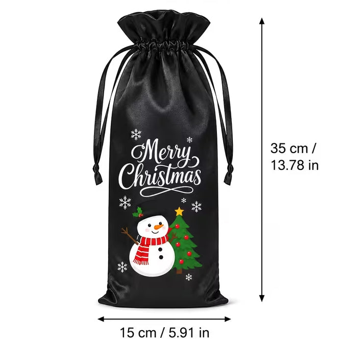 Black Christmas-themed drawstring gift bag with a printed snowman, Christmas tree, and 'Merry Christmas' text, shown with dimension arrows indicating 15 cm width and 35 cm height on a white background.