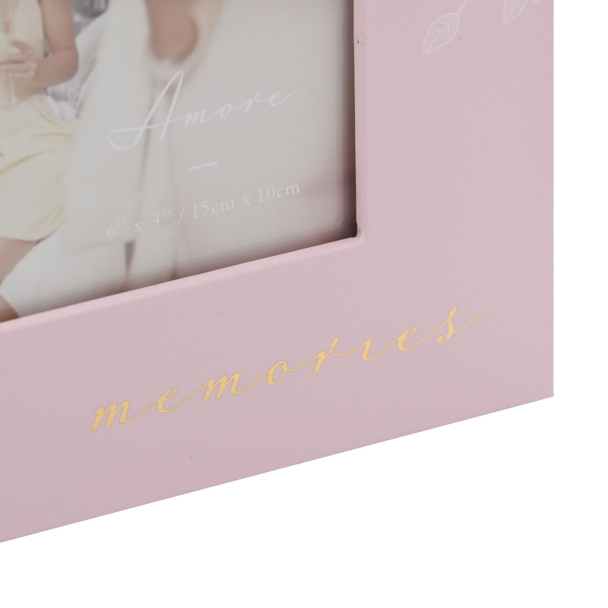 Pink photo frame detail with gold 'memories' script lettering