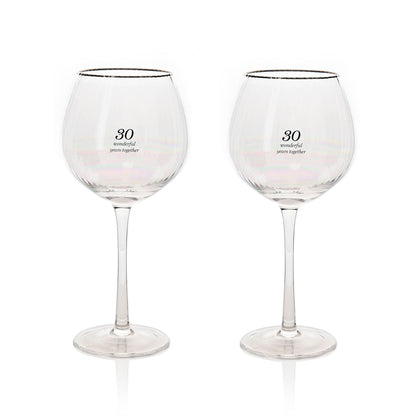 Pair of stemmed gin glasses with gold rim and 30 label on bowl