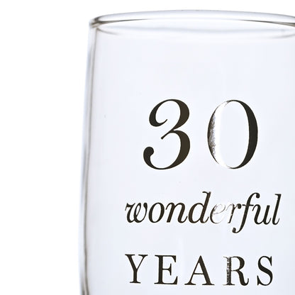 Close-up champagne flute with '30 wonderful YEARS' decorative anniversary text
