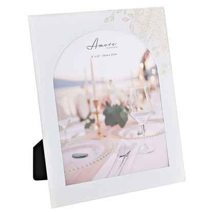 White arch glass photo frame angled view with floral top-right trim