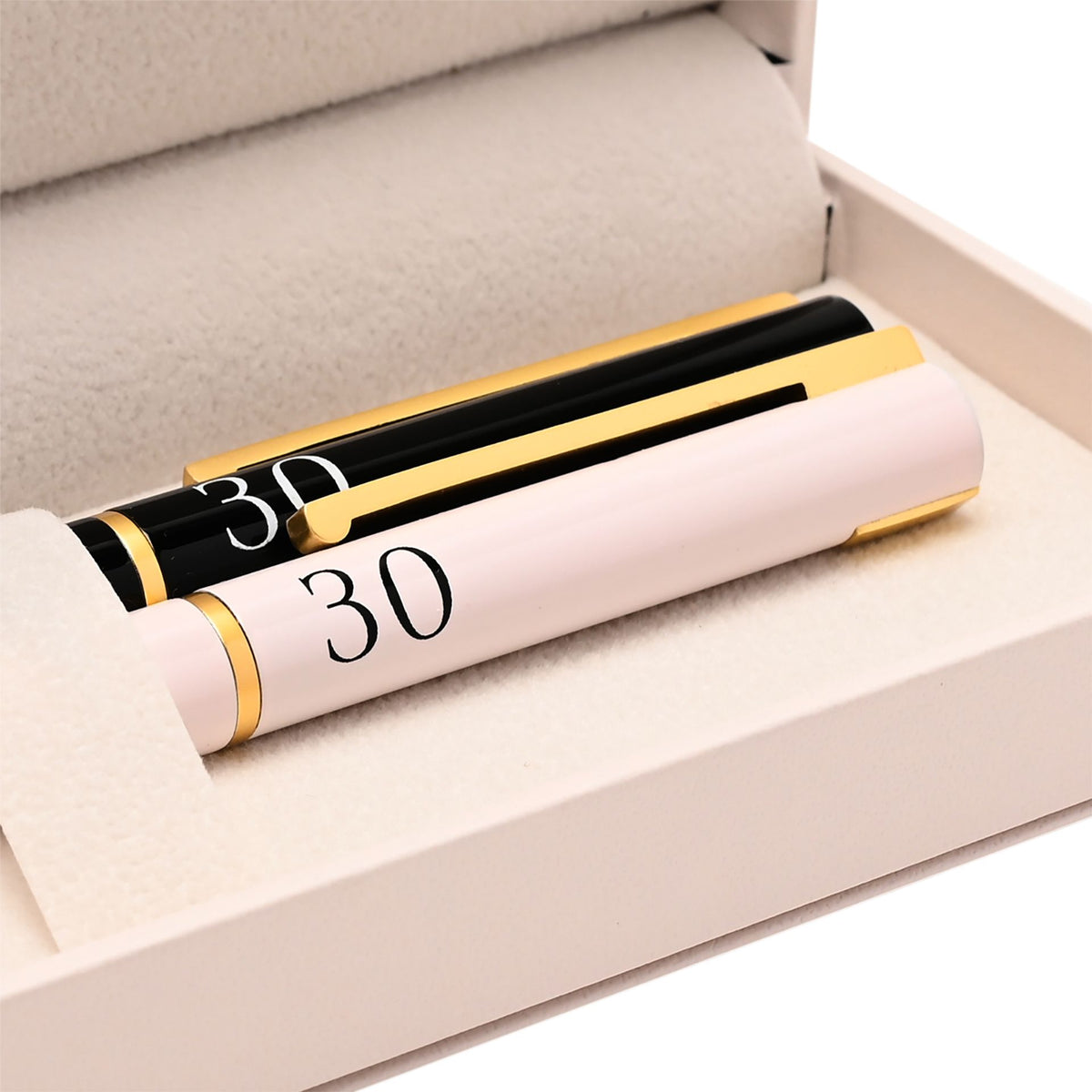 Two pens in gift tray showing black and blush barrels with gold trim