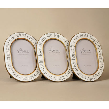 Set of three oval photo frames with gold rims and 'Amore by Juliana' inserts
