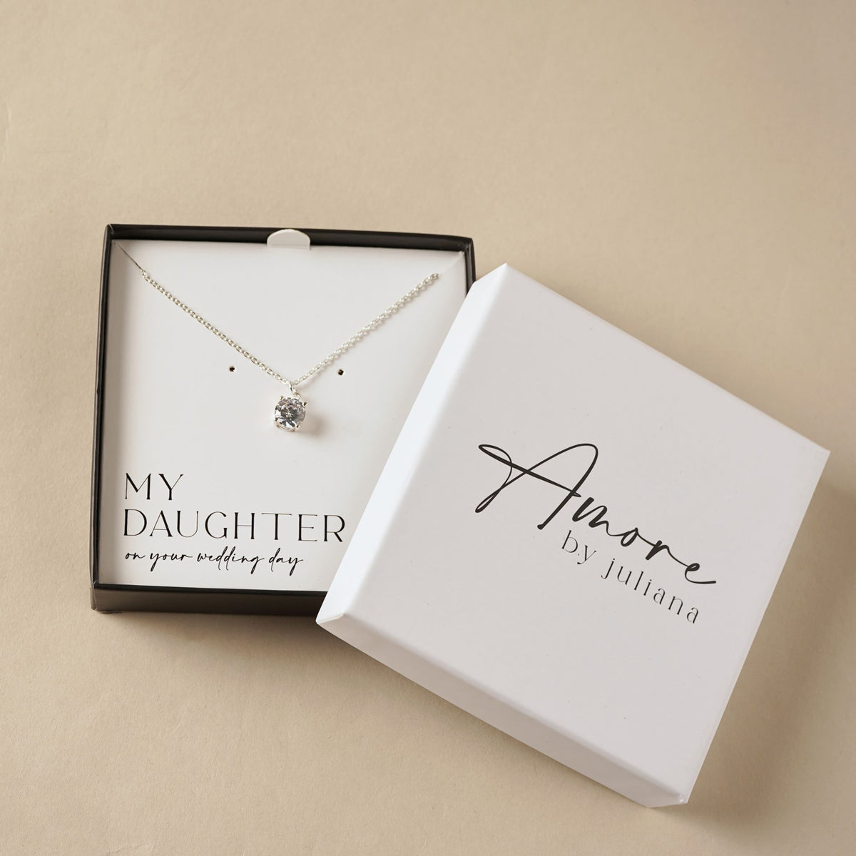 Silver-tone necklace with round crystal pendant inside gift box for daughter