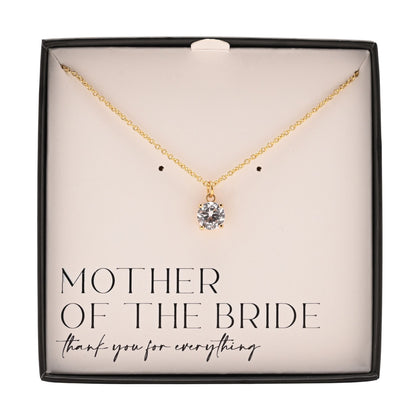 Gold-plated necklace with round crystal pendant centered in gift box