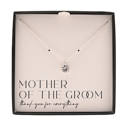 Silver-plated necklace with round crystal pendant lying in gift box