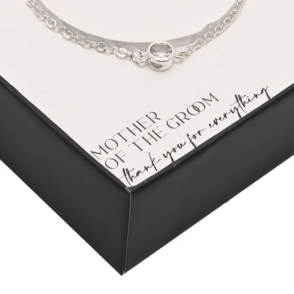 Silver-plated bracelet close-up: round clasp charm with small stone