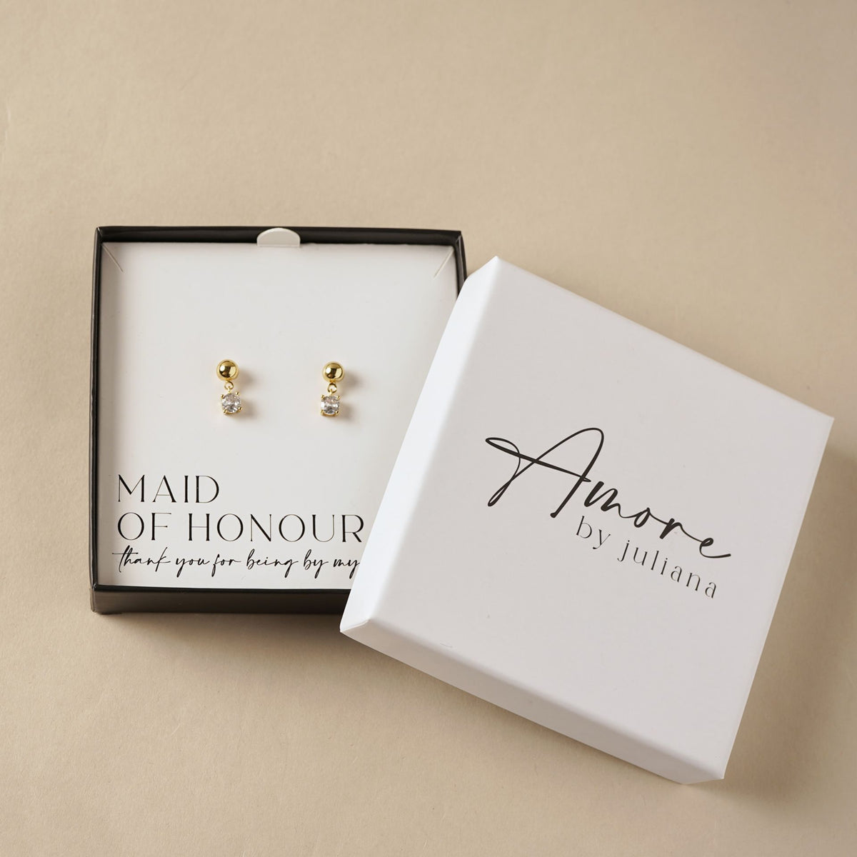 Gold-plated stud earrings with small clear crystal dangle in gift box
