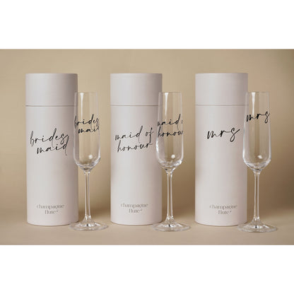 Multiple champagne tube sets with black script labels: brides, maid, maid of honour, mrs.