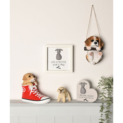 Dog-themed wall shelf display with small white framed plaque reading 'Life is better with a Dog'