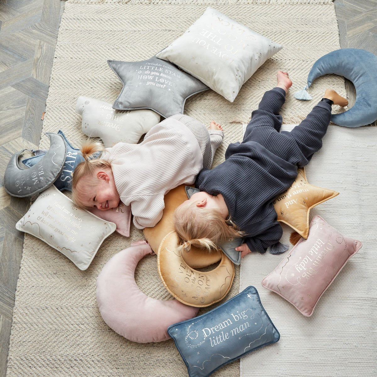 Dusty pink rectangular velvet cushion with gold “Dream big little lady” lettering on floor