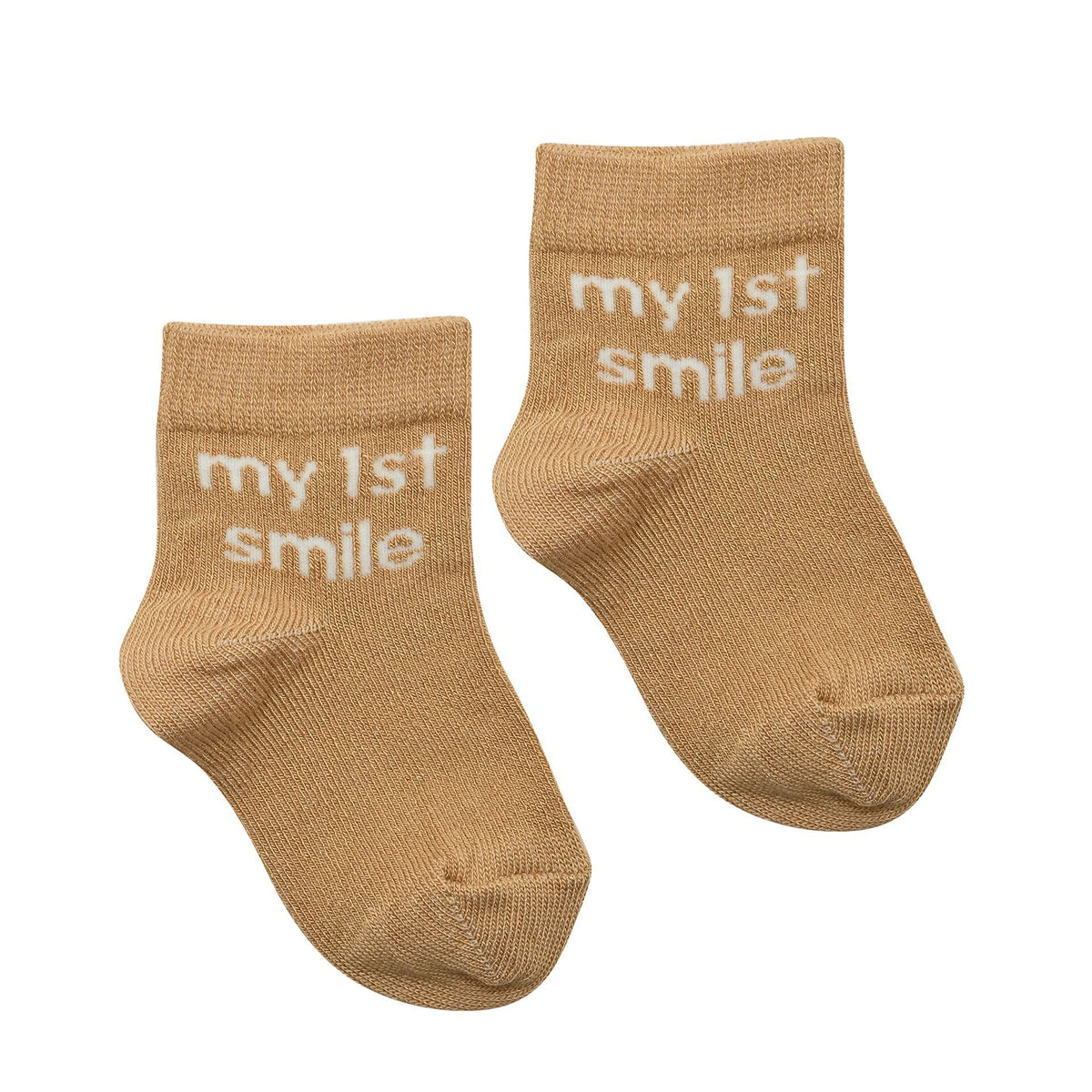 Pair of tan baby socks with "my 1st smile" text on cuff