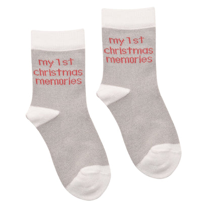 Pair of grey baby socks with red “my 1st Christmas memories” lettering