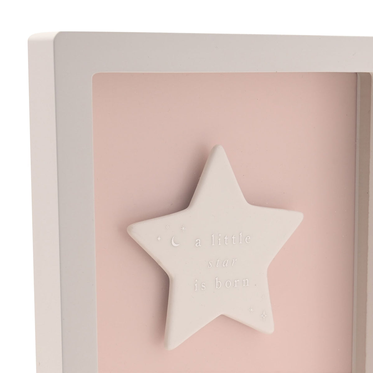Close-up of pink framed baby plaque with raised star and engraved message
