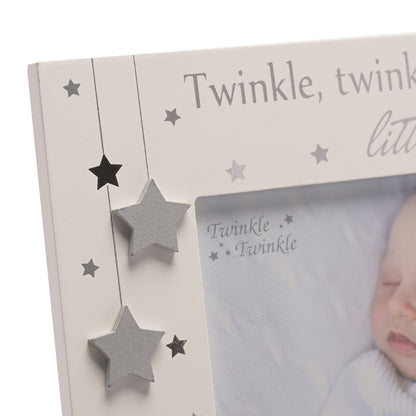 Close-up of star-shaped embellishments on a light photo frame with window