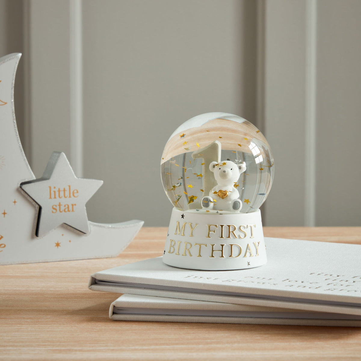 Bambino water ball on base with bear figure and “My First Birthday” text