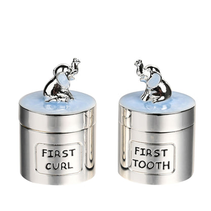 Silverplated baby keepsake boxes with blue tops, elephant figures, labels FIRST CURL and TOOTH